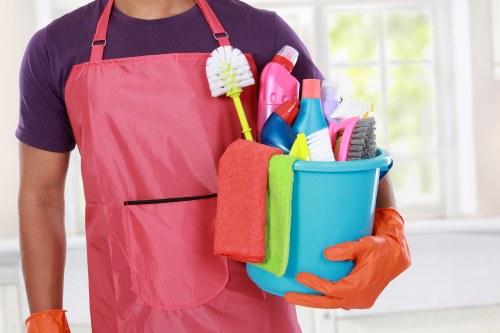 Local oven cleaner working in a modern St Johns Wood apartment kitchen
