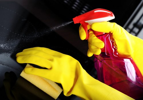 Professional cleaner maintaining a kitchen in St Johns Wood