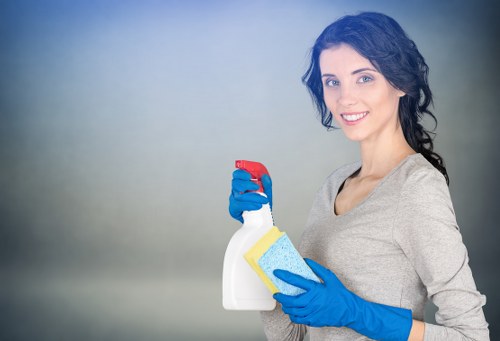 Professional cleaners working in a St Johns Wood meeting room and reception space